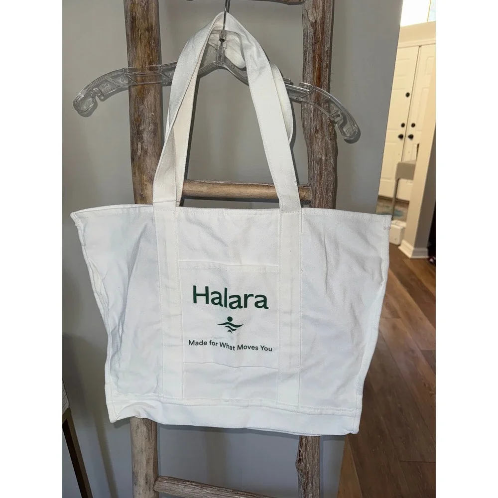 Women's white Halara canvas tote bag with a‎ green logo and text NWT travel gym